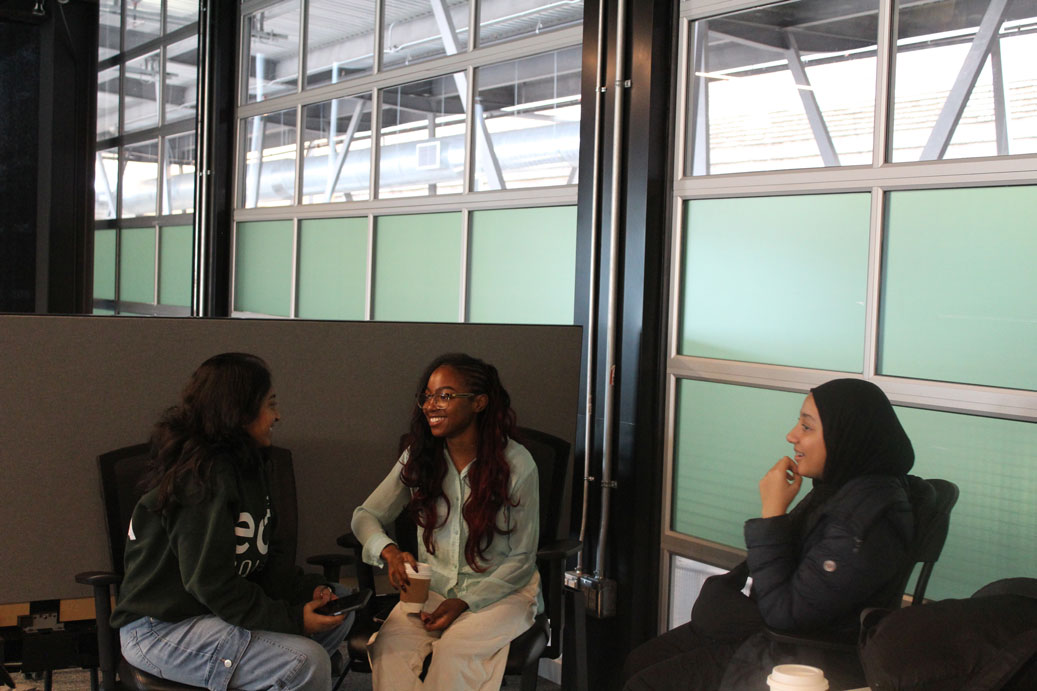 Young women connecting and sharing experiences