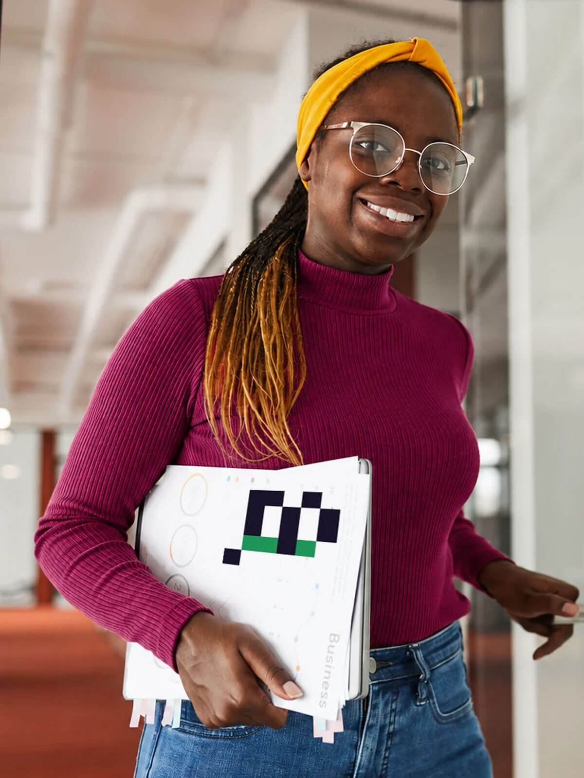 Young professional holding A2I learning materials